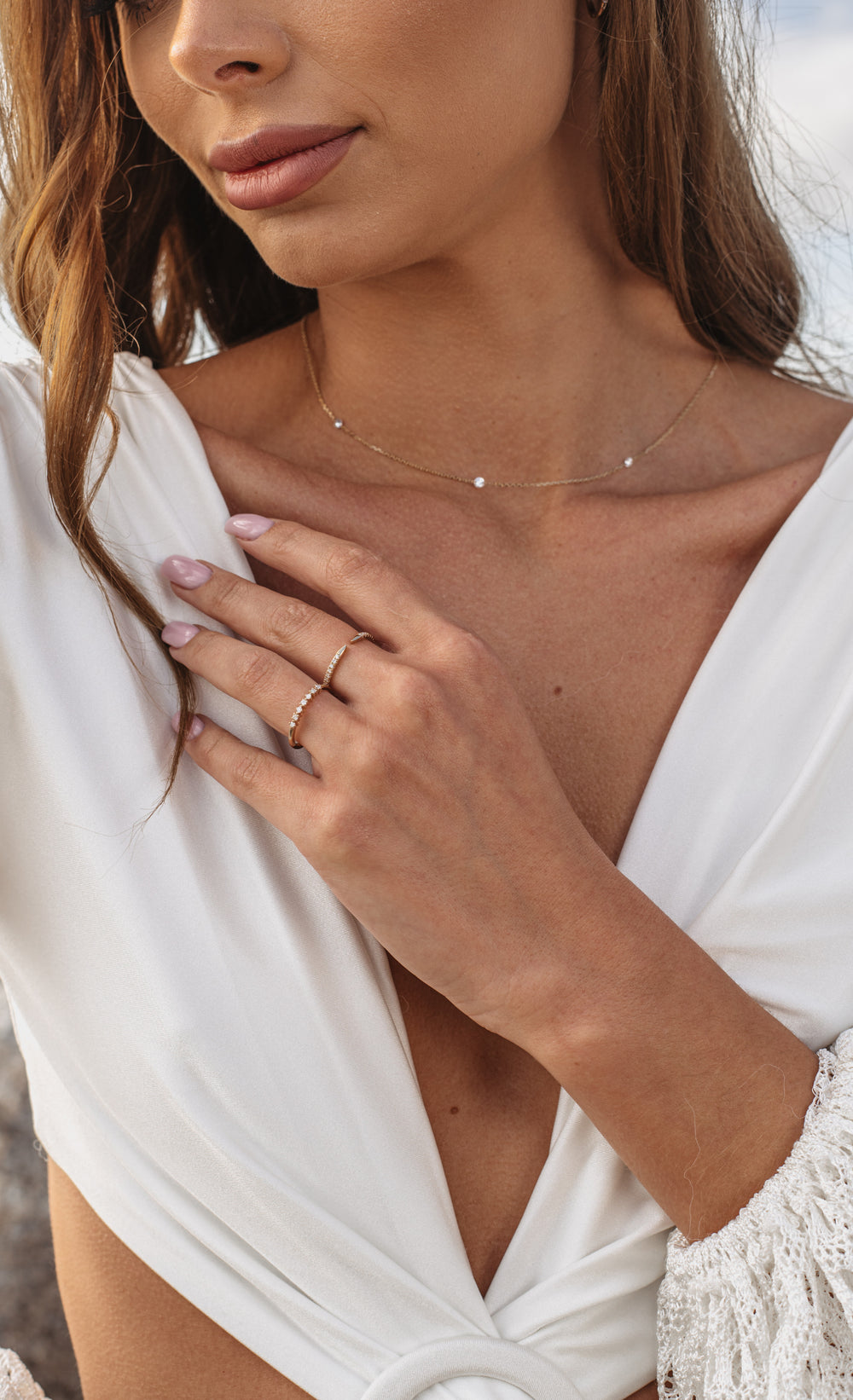 Floating Diamond Necklace on model at beach