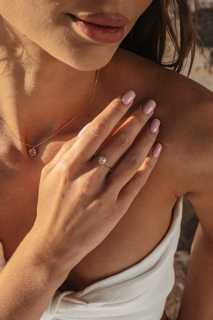 Moonstone Necklace and Bracelet on model at beack