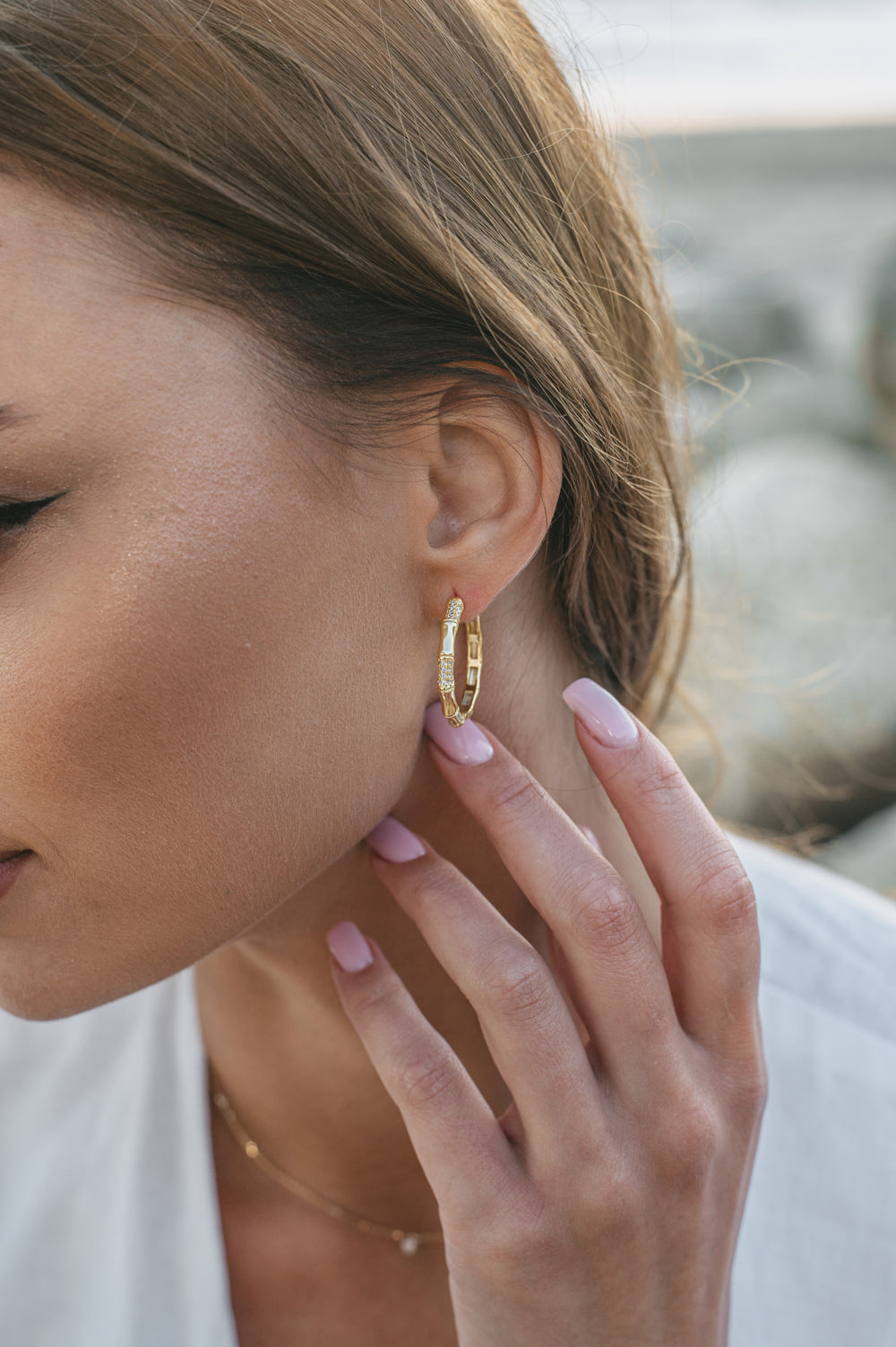 gold plated earrings on model