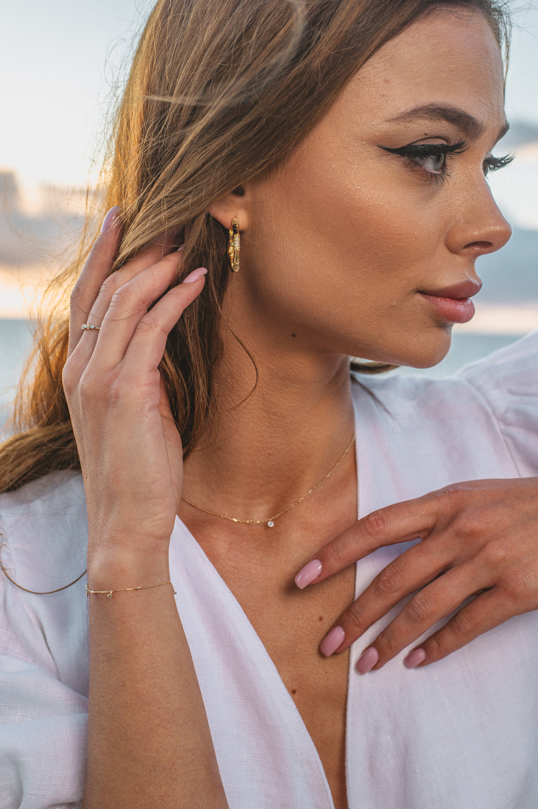 gold plated earrings on model